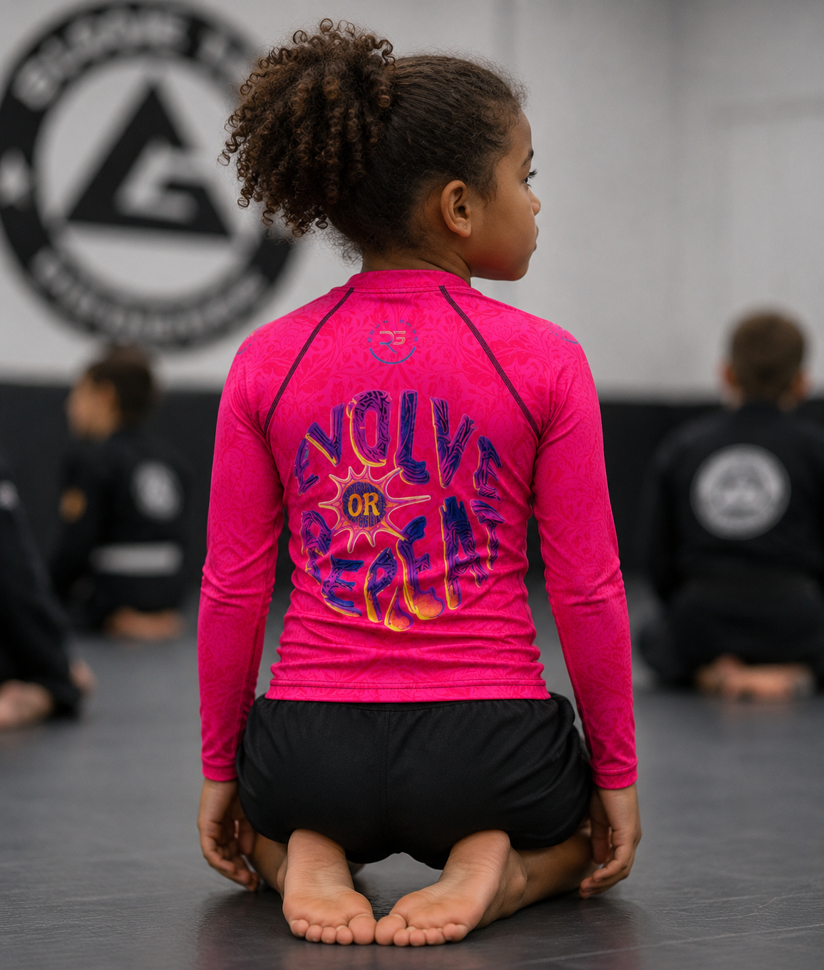 Roll Gear Evolve or Repeat Youth Girls Rash Guard, back view, additional angle.