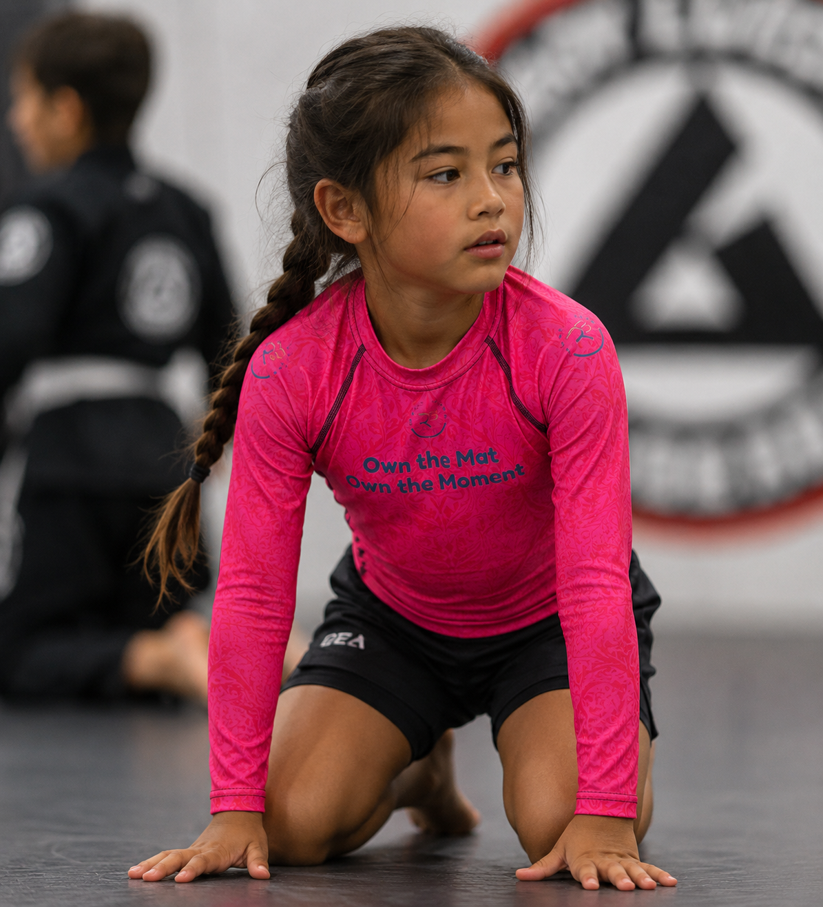 Roll Gear Evolve or Repeat Youth Girls Rash Guard, front view, additional angle.