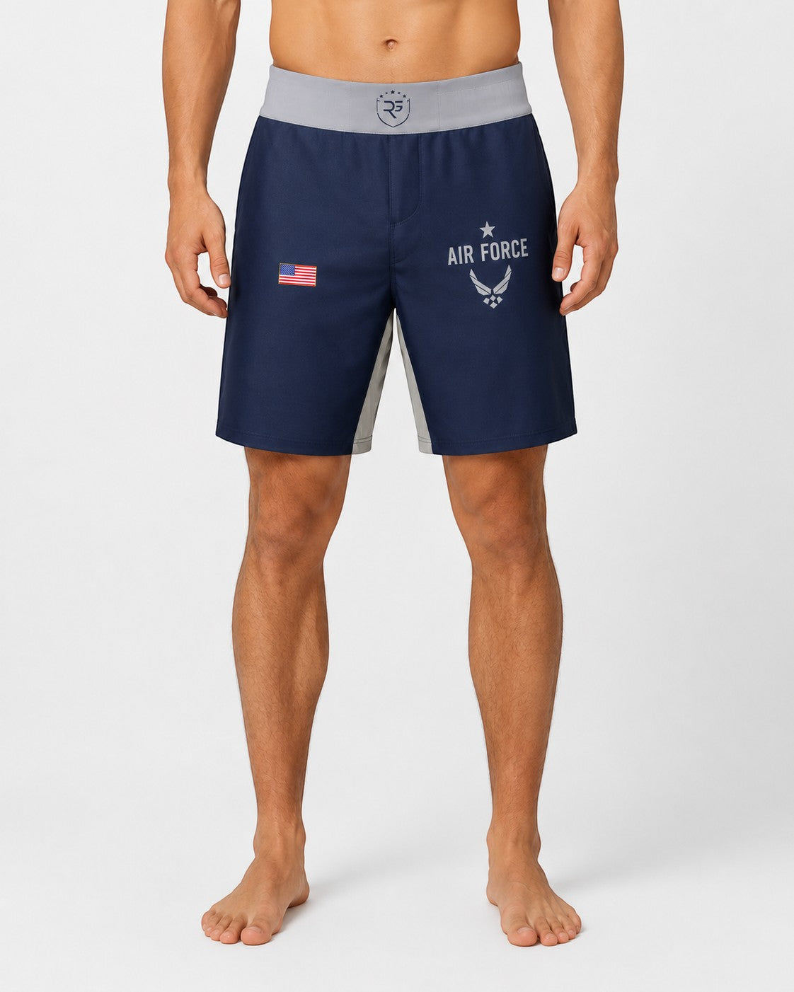 Roll Gear Air Force grappling shorts in navy blue with grey side panels and US flag detail. Features Air Force logo and text.