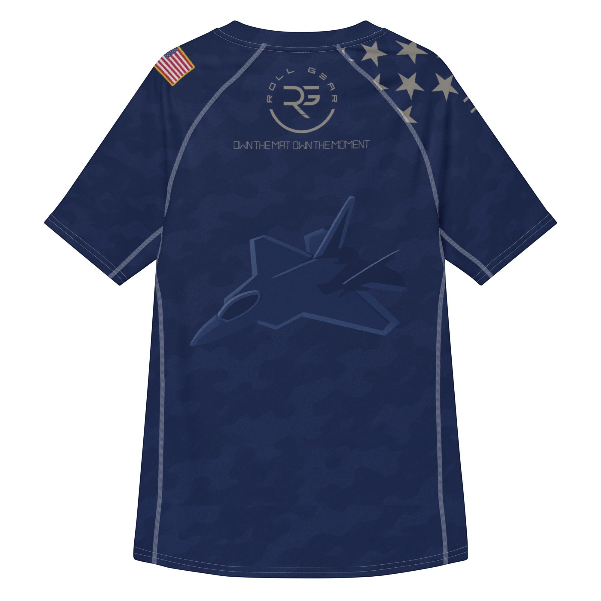 Roll Gear Unisex Air Force short sleeve rash guard in navy blue with camouflage print, jet graphic, and US flag detail.
