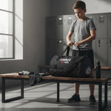Roll Gear LLC black cylinder duffel bag with "Earned Not Given" graphic, for training and travel.