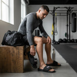Roll Gear black men's slides with cushioned footbed and secure strap, perfect for recovery.