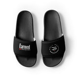Roll Gear black men's slides with cushioned footbed and secure strap featuring 'Earned' graphic and logo.
