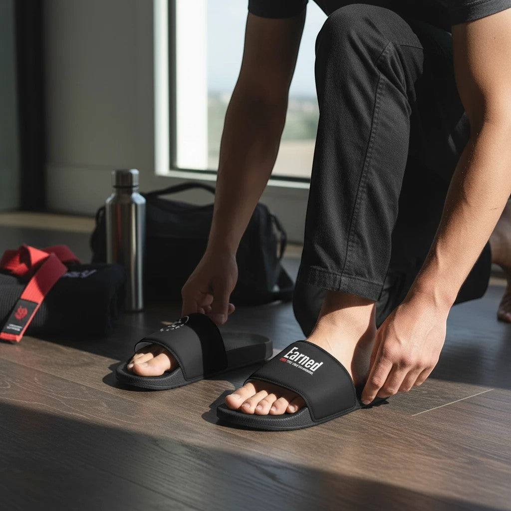 Roll Gear Men's Slides – Black, man slipping on the slides in a locker room.