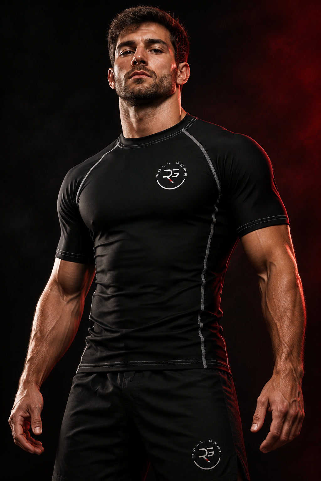 Roll Gear Solid Performance Rash Guard – Black – Adult Unisex, worn by a man standing in a dark gym.