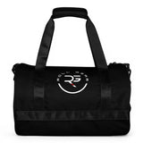 Black polyester cylinder duffel bag by Roll Gear with white and red logo. Features dual handles and a detachable shoulder strap.