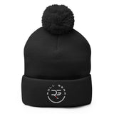 Roll Gear black acrylic knit pom pom beanie hat with embroidered logo on cuff.