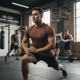Roll Gear brown short sleeve BJJ rash guard for men, moisture-wicking performance fabric, unisex fit.