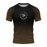 Roll Gear adult short sleeve rash guard with black to brown gradient fade and circular logo on chest.