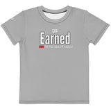 Roll Gear kids grey t-shirt with "Earned Not Given" graphic and "OWN THE MAT. OWN THE MOMENT." text.