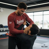 Roll Gear Earned Not Given Long Sleeve Rash Guard – Deep Red – Men’s, man drilling a head-control grip.