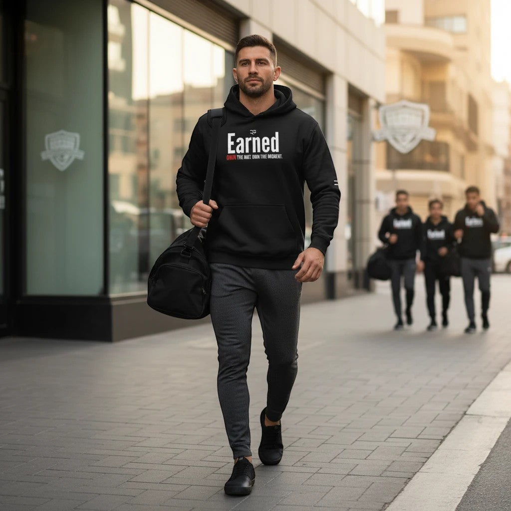 Roll Gear black cotton blend Earned Not Given Legacy Edition hooded sweatshirt with white and red graphic text.