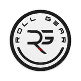 Roll Gear circular embroidered patch with black RG logo on white, red border, and black text.