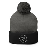 Roll Gear embroidered pom pom beanie hat in charcoal grey and black acrylic knit with logo.