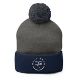 Roll Gear embroidered pom pom beanie hat in charcoal grey and navy blue acrylic knit.