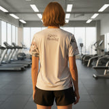 Roll Gear white athletic t-shirt with floral print on sleeves and "Always Blooming" text on back. Lightweight, breathable fabric.