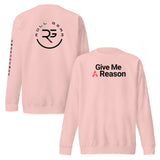 Roll Gear light pink crewneck sweatshirt with "Give Me A Reason" graphic on front and logo on back.