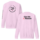 Roll Gear pink crewneck sweatshirt with "Give Me A Reason" graphic on front and logo on back.
