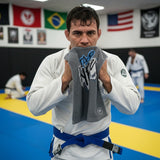 Roll Gear HYPE training towel with graffiti print on front and absorbent cotton back. Gray.