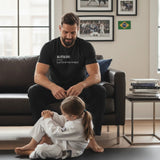 Black heavyweight cotton tee, front view of the Jiu Jitsu Dad definition print in cream lettering.