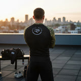 Roll Gear black performance rash guard with Multicam sleeves and US flag patch. Athletic fit, long sleeve.