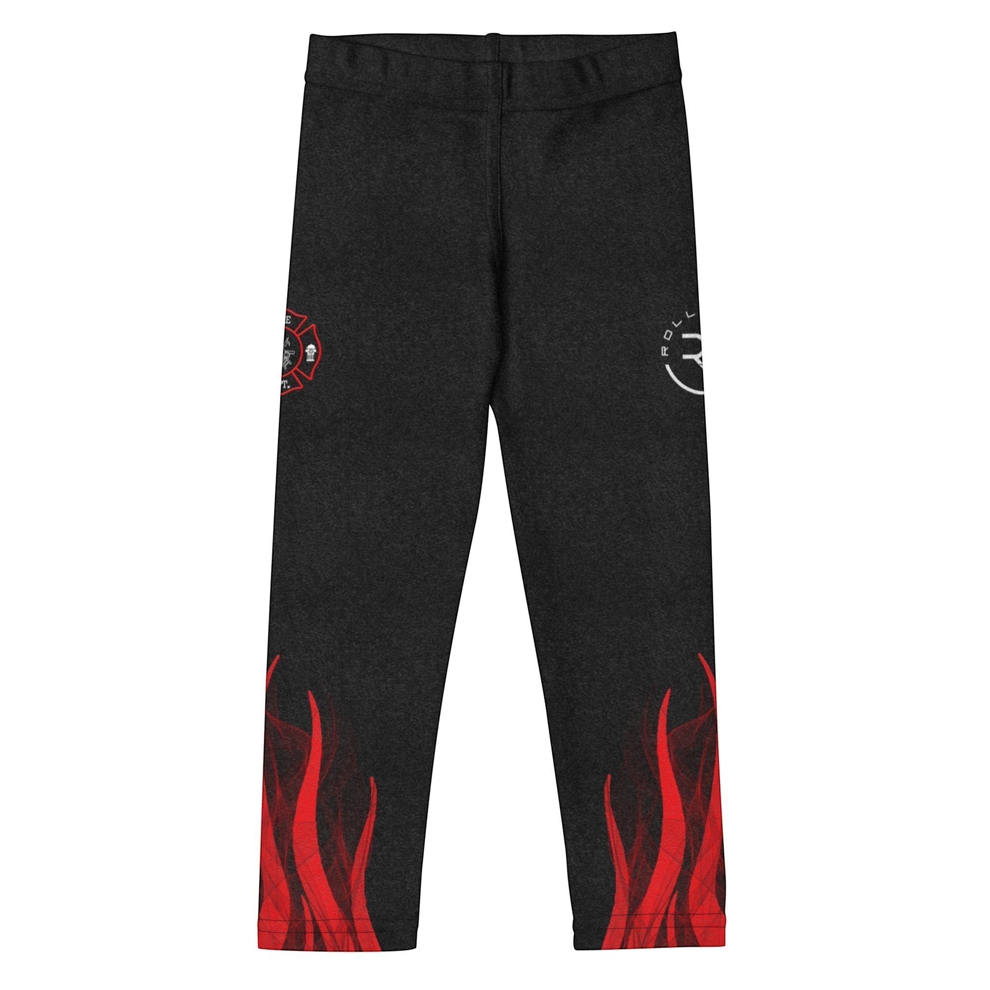 Roll Gear black polyester-spandex compression spats for kids with red flame graphics and firefighter emblems.