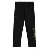 Roll Gear Kids Marines “Gold” compression spats in black with gold USMC graphics. Four-way stretch polyester-spandex blend.
