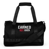 Roll Gear LLC Earned Not Given black polyester cylinder duffel bag with padded handles and shoulder strap.