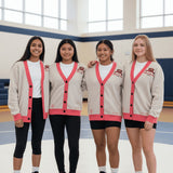 Roll Gear LLC oatmeal knit cardigan with coral trim, bow emblem on chest, and Girls on the Mat text on back.