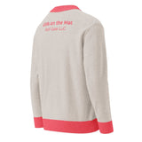 Roll Gear LLC oatmeal knit cardigan with coral trim and Girls on the Mat lettering on back.