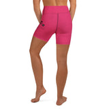 Roll Gear LLC women's bright pink biker shorts with a distressed texture and 'Girls on the Mat' graphic. High-waisted athletic shorts.