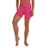 Roll Gear LLC Women's Girls on the Mat biker shorts in bright pink with a distressed texture and graphic logo.
