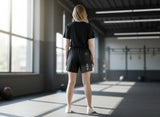 Roll Gear SWAT Grappling Shorts, back view on a woman in a gym.