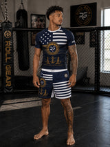 Roll Gear Navy Grappling Shorts – Honor for Valor Edition. Navy blue with white stripes and anchor graphics. Lightweight, 4-way stretch fabric.