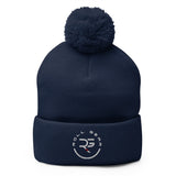 Roll Gear navy blue knit pom pom beanie hat with embroidered logo on cuff.