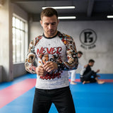 Roll Gear Never Accept Rash Guard – Black – Men's, front view, worn while wrapping hands in the academy.