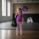 Roll Gear Girls Bow Spats in pink with a bow pattern, made from microfiber yarn for active kids. Features elastic waistband.