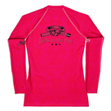 Roll Gear women's long sleeve rash guard in bright pink with "Girls on the Mat" graphic and martial arts belt detail.