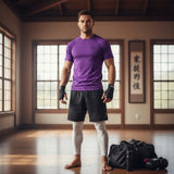 Roll Gear Solid Performance Rash Guard – Purple – Adult/Unisex, front view, worn with hand wraps in a dojo.