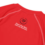 Roll Gear Performance Rash Guard – All Red Edition, close-up of the Roll Gear emblem and Own the Mat text.