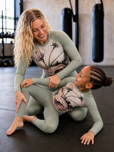 Roll Gear women's long sleeve sage green rash guard with floral print, designed for athletic training.