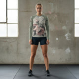 Roll Gear women's sage green long sleeve rash guard with floral print, moisture-wicking and UPF protective.