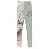 Roll Gear youth spats in sage green with vintage floral artwork on one leg and text on the other. Four-way stretch microfiber.