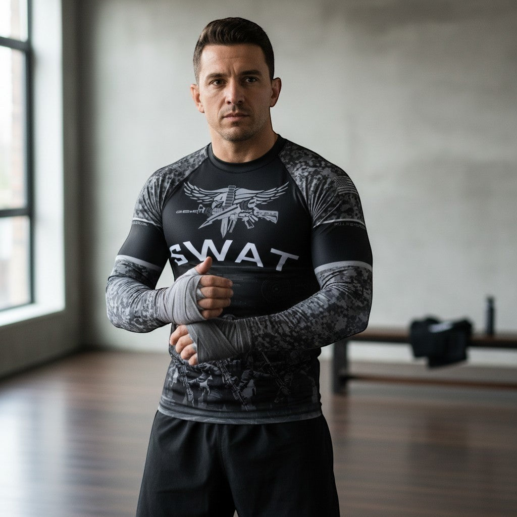 Roll Gear Men's SWAT Edition long sleeve rash guard in black with urban camo sleeves and tactical graphics.