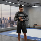 Roll Gear Men's SWAT Edition long sleeve rash guard in black with urban camo sleeves, tactical eagle emblem, and graphics.