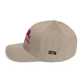 Roll Gear tan baseball cap with pink embroidered belt graphic and "Girls on the Mat" text, GOTM logo on side.