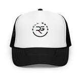 Roll Gear trucker hat with white front panel, black mesh back, and embroidered logo. Adjustable snapback.
