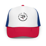 Roll Gear trucker hat with white front panel, red bill, and blue mesh back. Features embroidered logo.