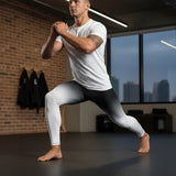 Roll Gear White Fade Training Spats – White/Black – Men's, man lunging in a gym.