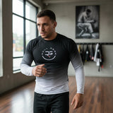 Roll Gear men's long sleeve rash guard in white and black fade. Moisture-wicking performance fabric with flatlock seams.